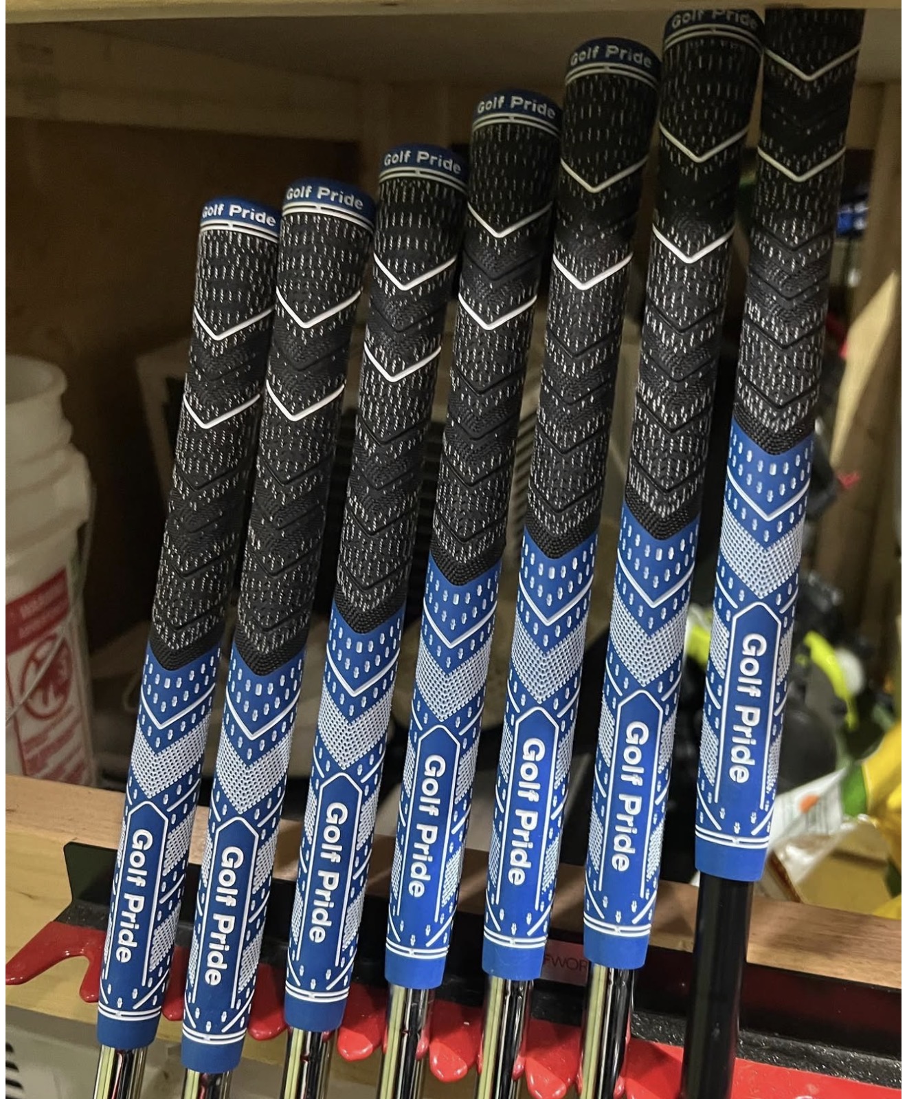 Color-matched Golf Pride grips installed on a full set