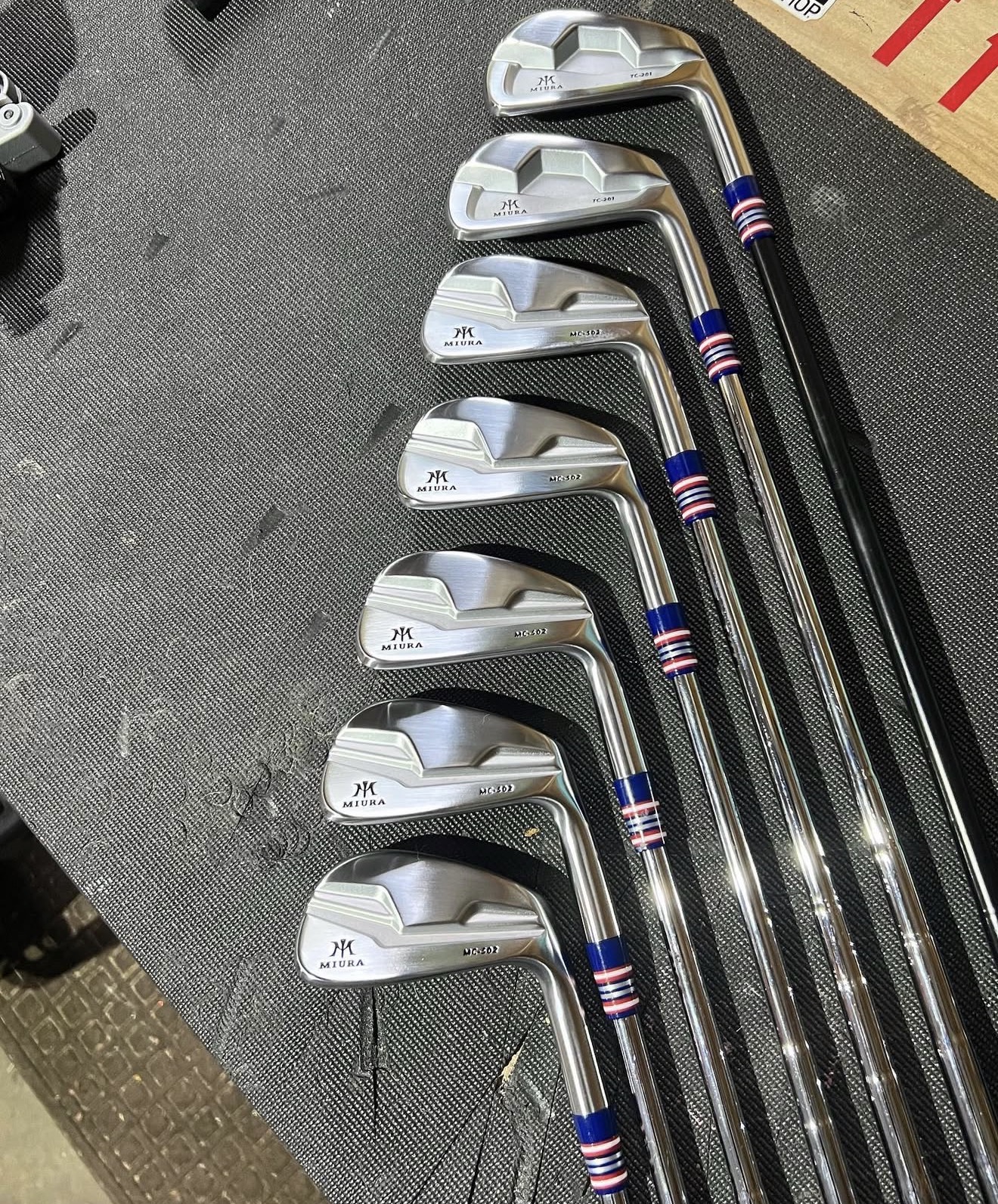 Full Miura MC-502 and TC-201 iron set with red, white and blue striped ferrules